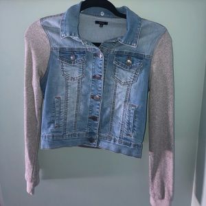 Jean jacket with grey knit sleeves